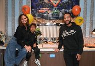 Chrissy Teigen and John Legend with Miles (Image via Getty)